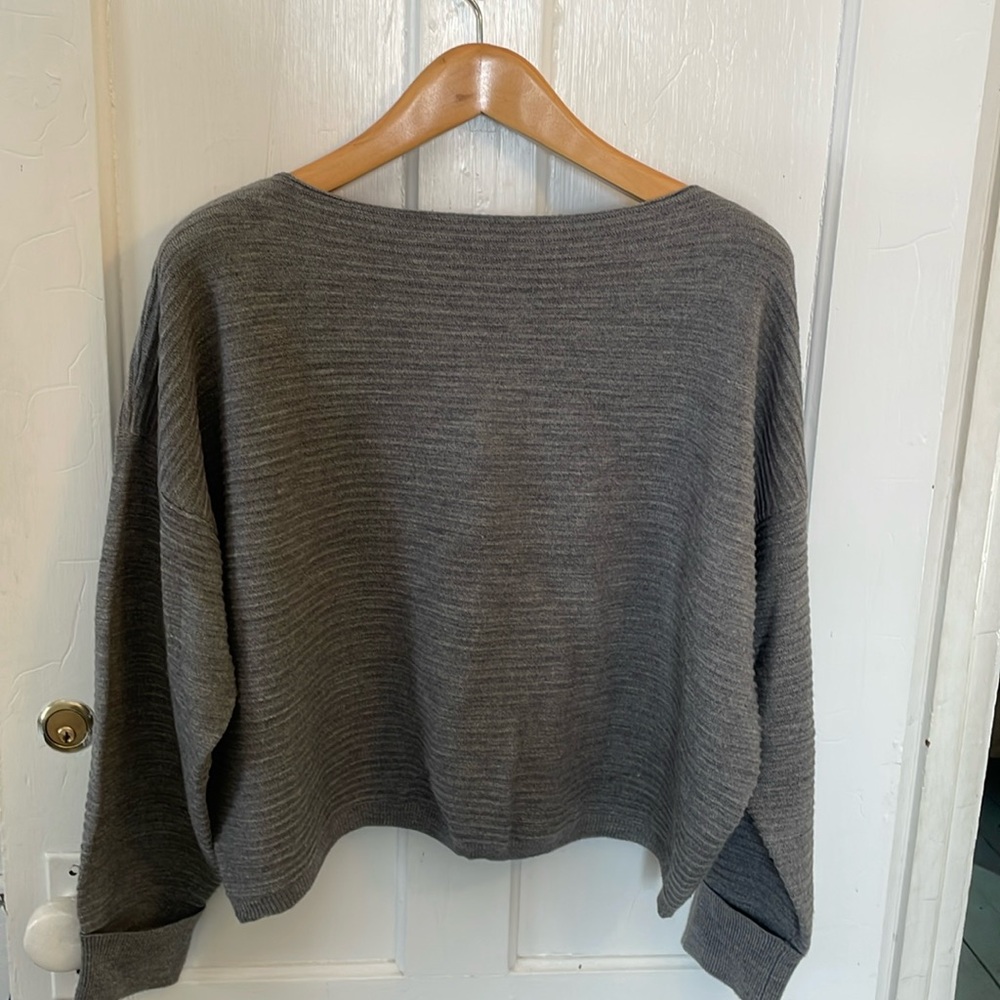 Boxy sweater with cuff on sleeve